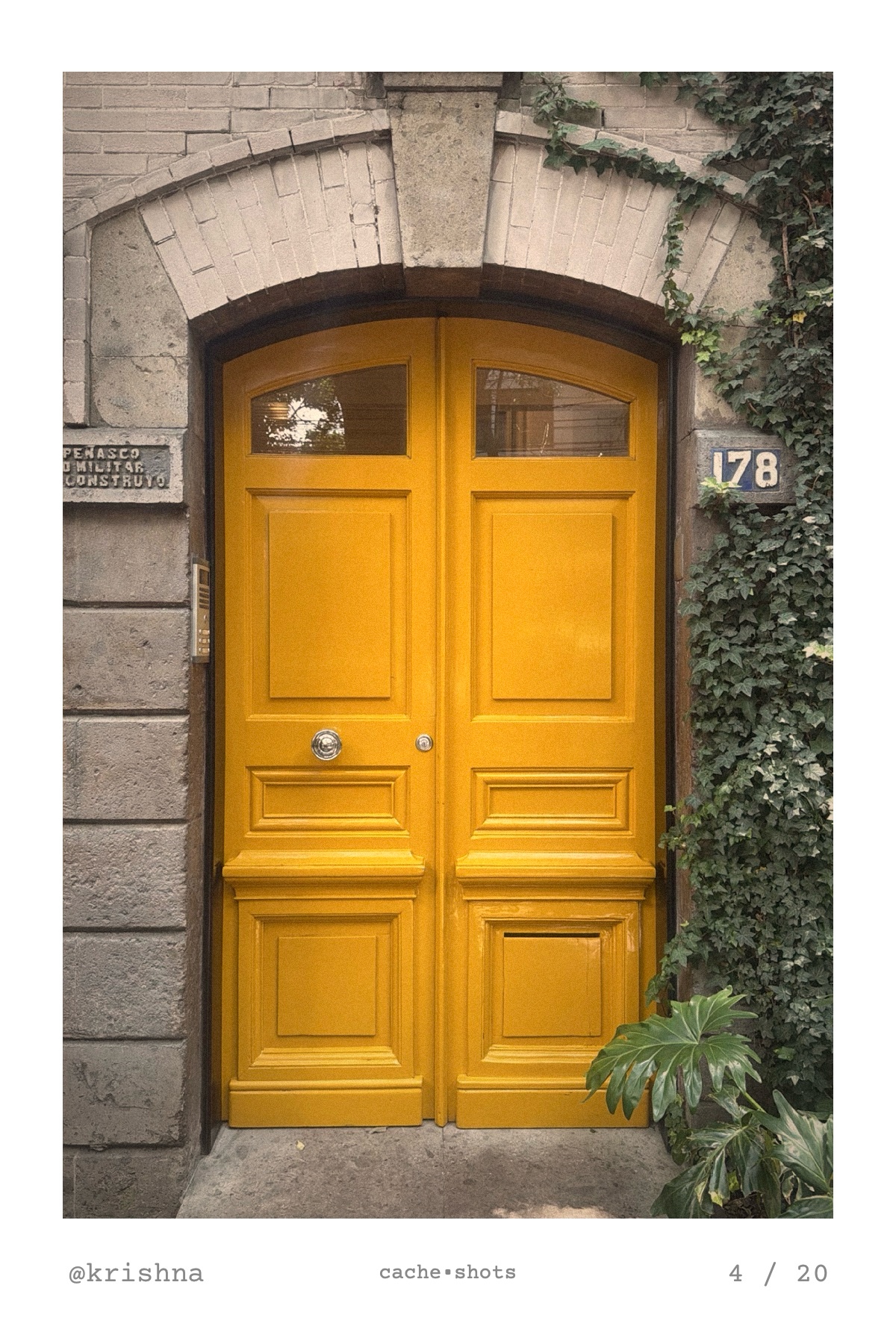a color print of a glossy yellow double door under a stone arch, by @krishna